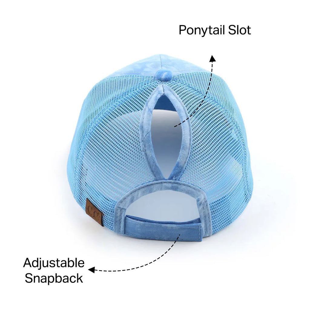 A light blue mesh trucker-style cap shown from the back, with callout arrows and text labels pointing to the 'Ponytail Slot' and 'Adjustable Snapback'.