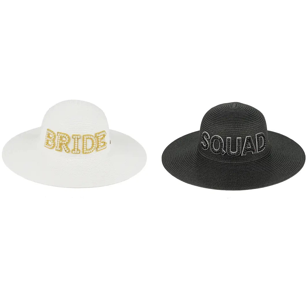 Two wide-brimmed straw-style hats shown side by side on a white background with text labels below. The left hat is white with 'BRIDE' in gold glitter lettering and is labeled 'BRIDE-WHITE'.