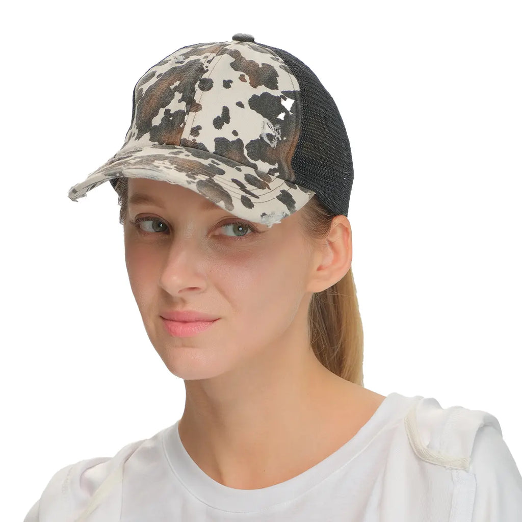 C.C Distressed Cow Print Criss-Cross Ponytail Baseball Cap