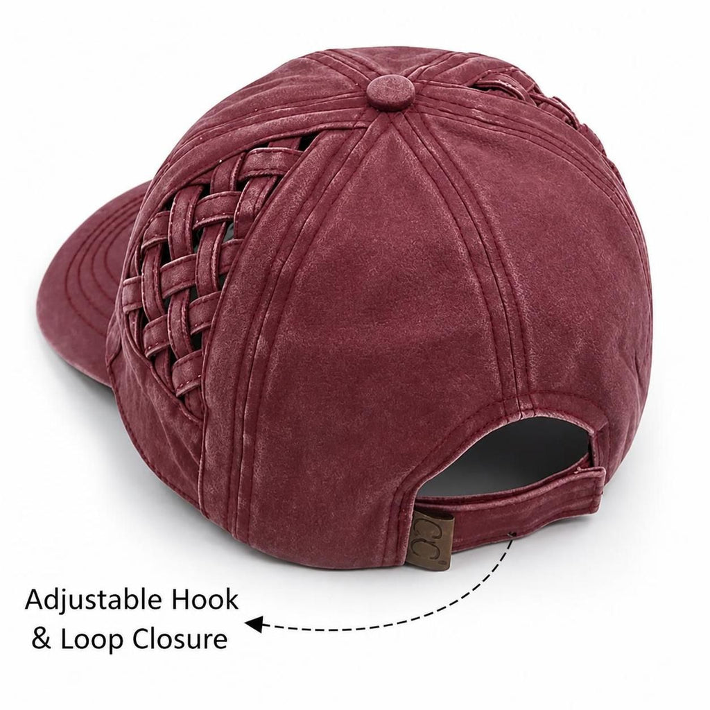 A dusty burgundy baseball cap shown from a rear three-quarter angle, featuring a woven side panel and an adjustable hook-and-loop closure with a text overlay pointing to it.