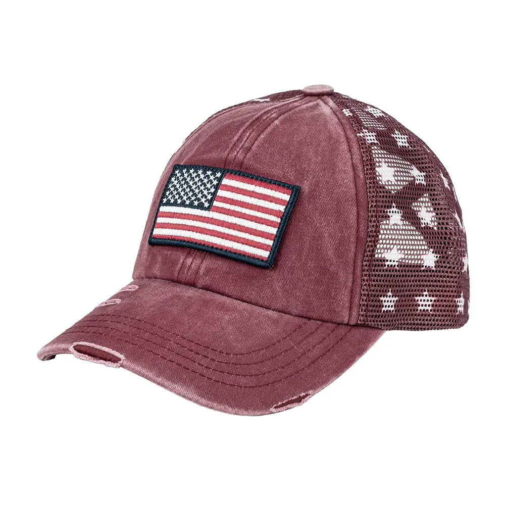 Maroon cap with American flag patch and camouflage mesh back on a white background