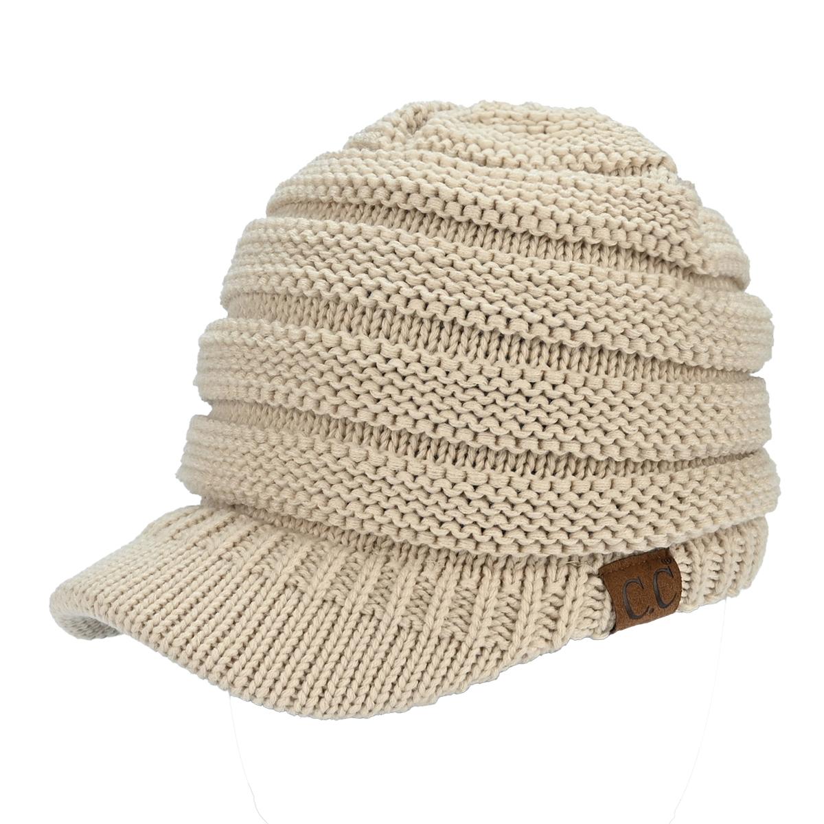 Beige knitted cap with a brown patch on a white background