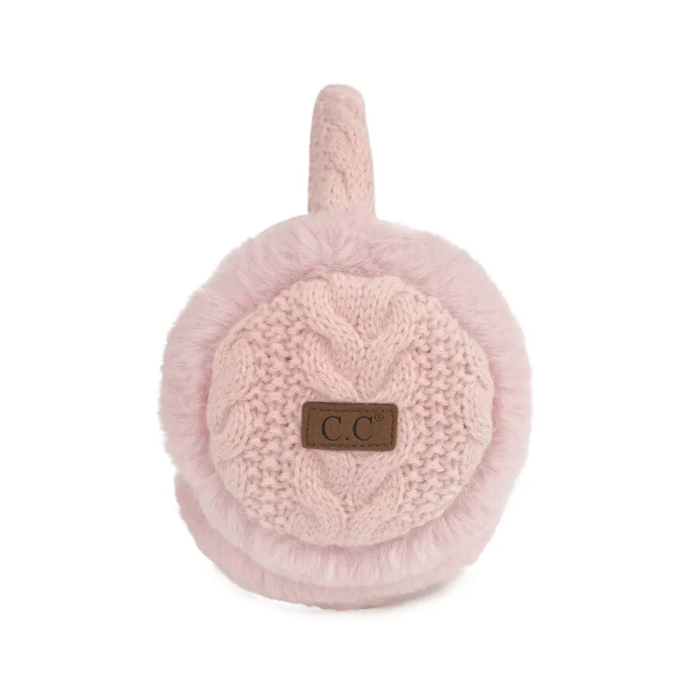 A pair of light pink knit and faux fur earmuffs with a small brown leather patch featuring the letters 'C.C' in the center, shown against a plain white background.
