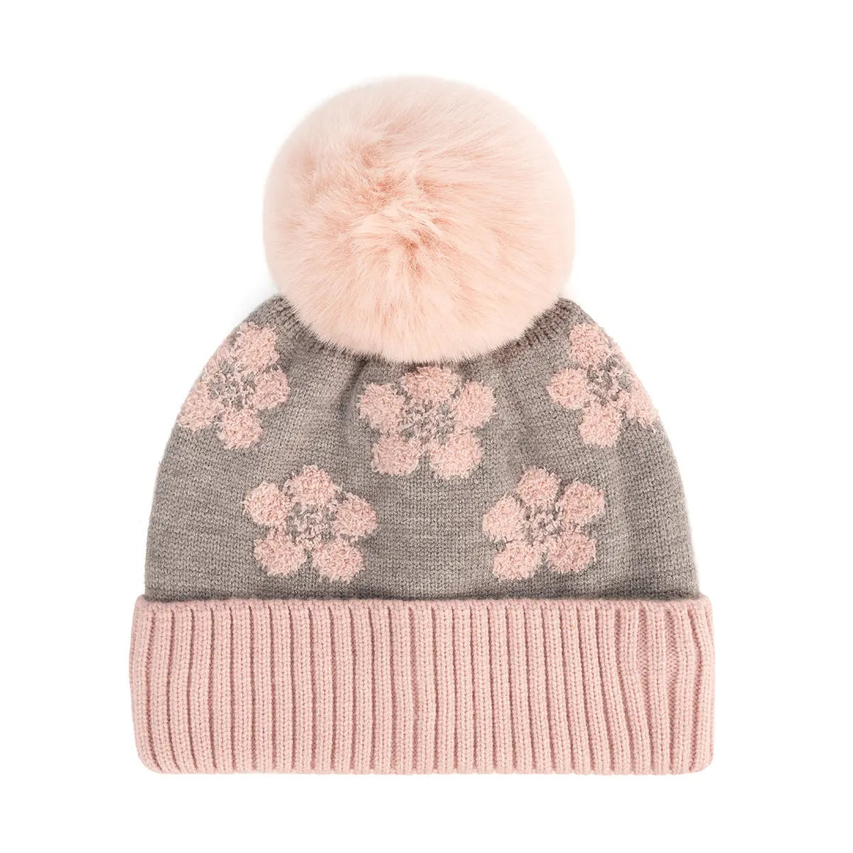 A knit pom-pom beanie hat featuring a gray body with pink floral patterns and a ribbed light pink cuff, topped with a fluffy light pink faux-fur pom-pom.