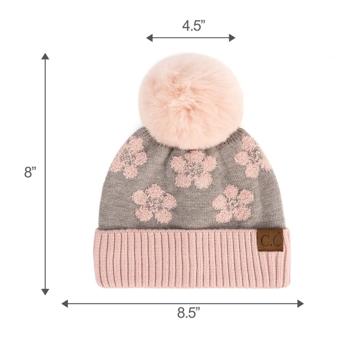 A gray knit beanie with a light pink pom-pom, pink floral pattern, and a pink ribbed cuff. Black dimension arrows and text show the hat is 8 inches tall.