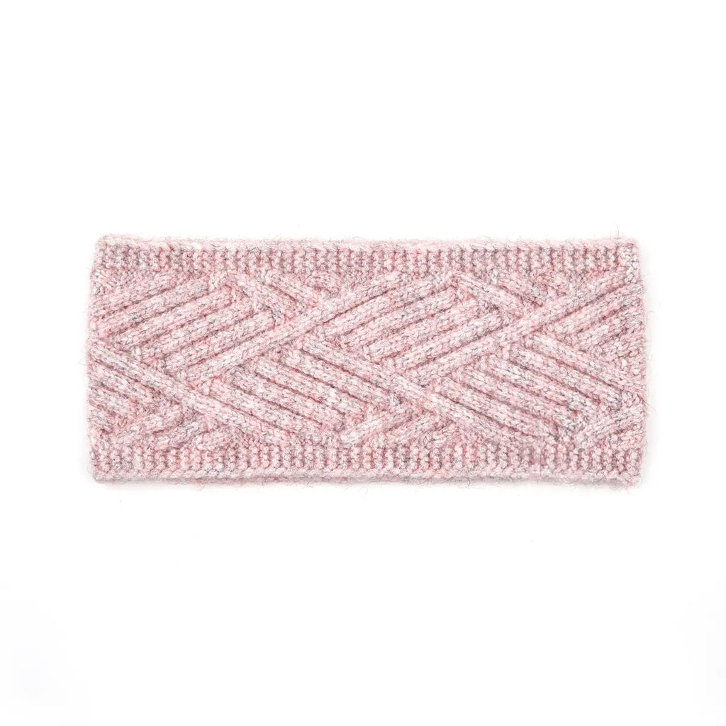 A rectangular knit headband in a variegated light pink and white pattern, featuring a textured chevron design, shown against a plain white background.