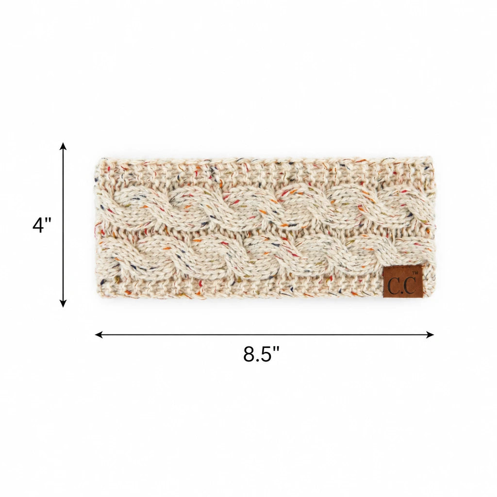 A knitted cable-pattern headband in a warm off-white/cream color with subtle multicolor flecks, shown with dimension arrows indicating 4 inches tall by 8.5 inches wide.