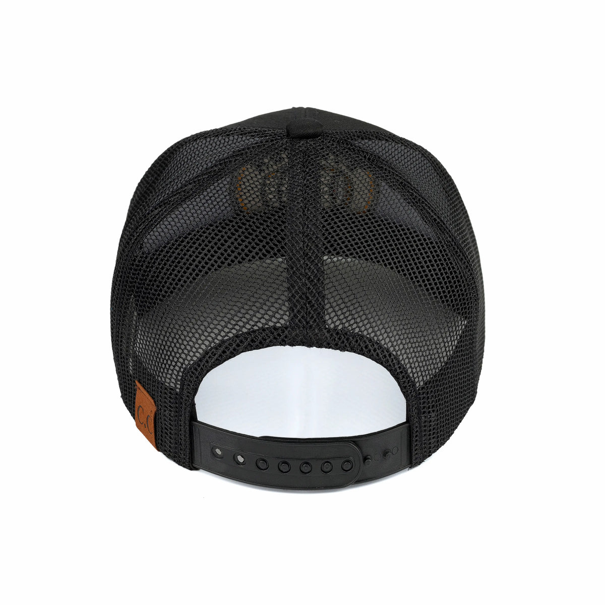 Rear view of a black trucker hat with a black mesh back, black adjustable strap, and a small brown leather patch on the side, shown on a white background.